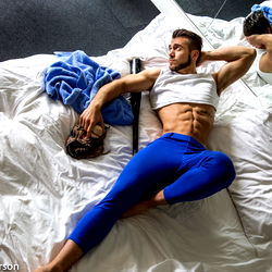 Fit Model Striking a Pose on Bed